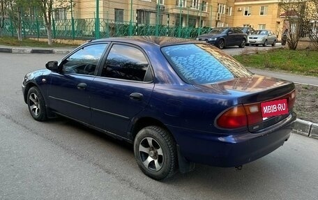 Mazda 323, 1994 год, 150 000 рублей, 6 фотография