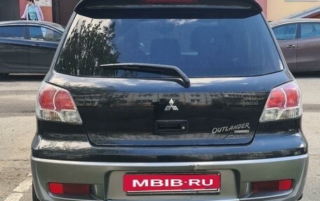 Mitsubishi Outlander III рестайлинг 3, 2004 год, 690 000 рублей, 2 фотография