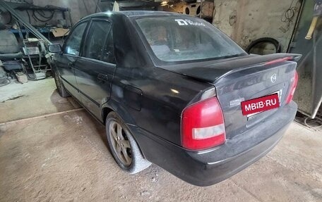 Mazda Protege, 2001 год, 285 000 рублей, 29 фотография