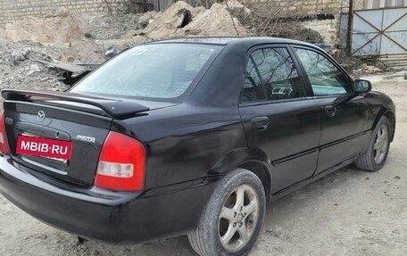 Mazda Protege, 2001 год, 285 000 рублей, 23 фотография