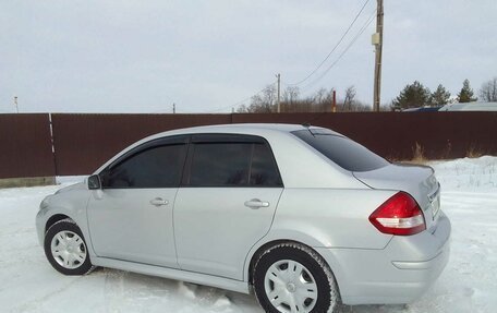 Nissan Tiida, 2010 год, 860 000 рублей, 9 фотография