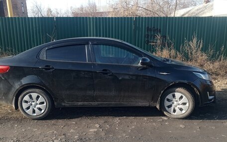 KIA Rio III рестайлинг, 2012 год, 750 000 рублей, 20 фотография