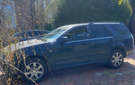 Cadillac SRX II рестайлинг, 2009 год, 600 000 рублей, 3 фотография