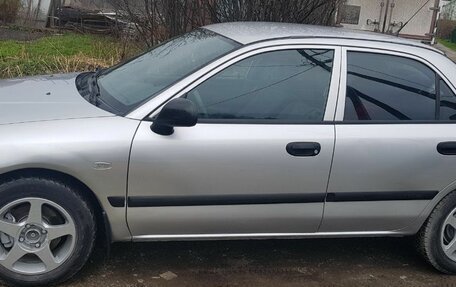 Mitsubishi Carisma I, 2002 год, 350 000 рублей, 28 фотография