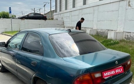 Mazda 323, 1997 год, 165 000 рублей, 5 фотография
