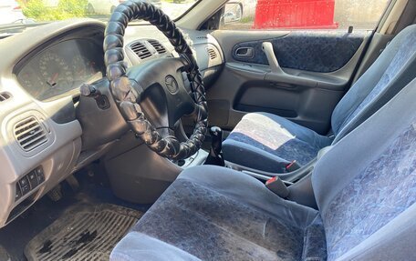 Mazda 323, 1999 год, 149 000 рублей, 9 фотография