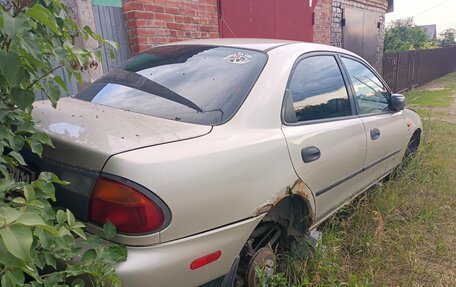 Mazda 323, 1998 год, 150 000 рублей, 13 фотография