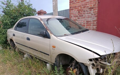 Mazda 323, 1998 год, 150 000 рублей, 12 фотография