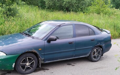 Mitsubishi Carisma I, 1997 год, 81 000 рублей, 2 фотография