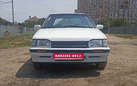Mazda 323, 1989 год, 250 000 рублей, 4 фотография