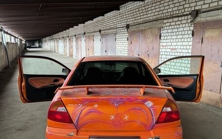 Mitsubishi Mirage VI рестайлинг, 2001 год, 50 000 рублей, 11 фотография