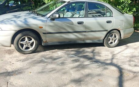 Mitsubishi Carisma I, 1998 год, 215 000 рублей, 1 фотография