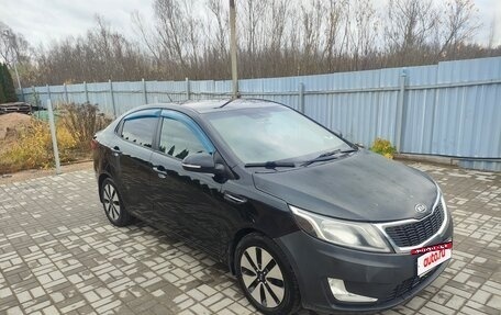 KIA Rio III рестайлинг, 2011 год, 680 000 рублей, 16 фотография