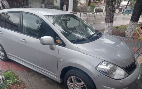 Nissan Tiida, 2010 год, 800 000 рублей, 8 фотография