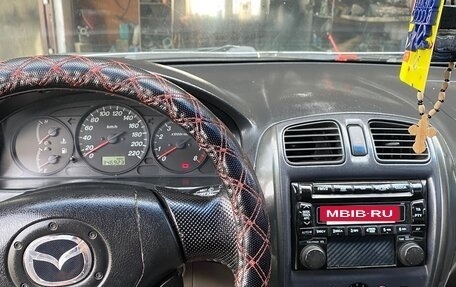 Mazda 323, 2002 год, 300 000 рублей, 12 фотография