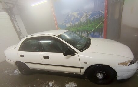 Mitsubishi Carisma I, 1998 год, 110 000 рублей, 10 фотография