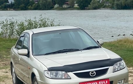 Mazda 323, 2002 год, 450 000 рублей, 21 фотография
