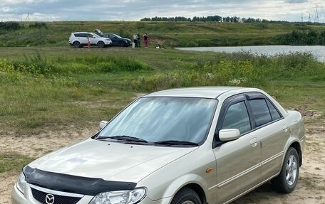 Mazda 323, 2002 год, 450 000 рублей, 25 фотография