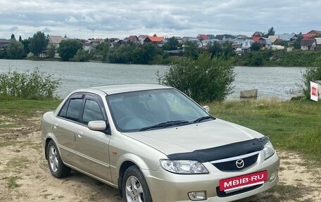Mazda 323, 2002 год, 450 000 рублей, 22 фотография