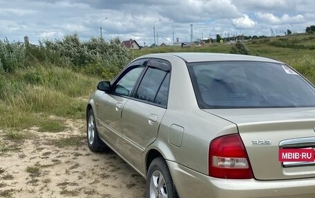 Mazda 323, 2002 год, 450 000 рублей, 26 фотография