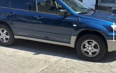 Mitsubishi Outlander III рестайлинг 3, 2004 год, 617 000 рублей, 2 фотография