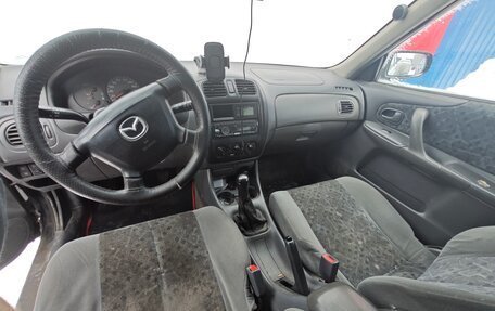 Mazda 323, 1999 год, 230 000 рублей, 9 фотография