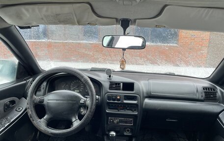 Mazda 323, 1998 год, 145 000 рублей, 12 фотография