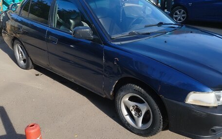 Mitsubishi Mirage VI рестайлинг, 1999 год, 80 000 рублей, 7 фотография