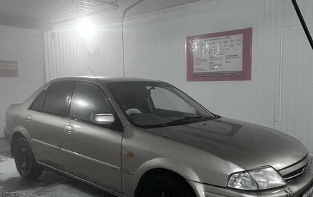 Ford Laser IV, 1999 год, 170 000 рублей, 2 фотография