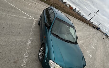 Mazda 323, 1998 год, 150 000 рублей, 9 фотография