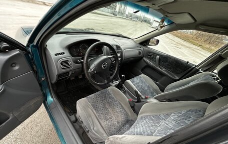 Mazda 323, 1998 год, 150 000 рублей, 11 фотография
