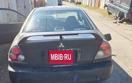 Mitsubishi Mirage VI рестайлинг, 2000 год, 190 000 рублей, 7 фотография