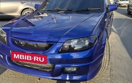 Mazda Familia, 2000 год, 1 фотография
