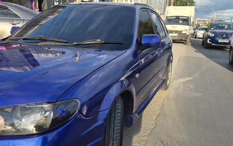 Mazda Familia, 2000 год, 5 фотография