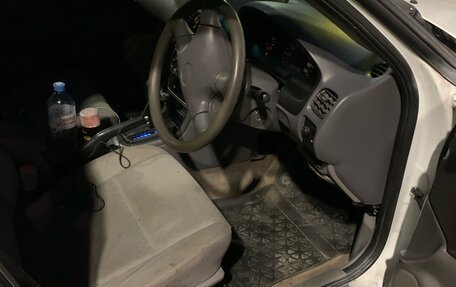 Nissan Sunny B15, 2000 год, 13 фотография