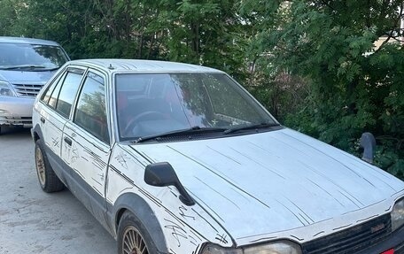 Mazda Familia, 1987 год, 111 000 рублей, 1 фотография