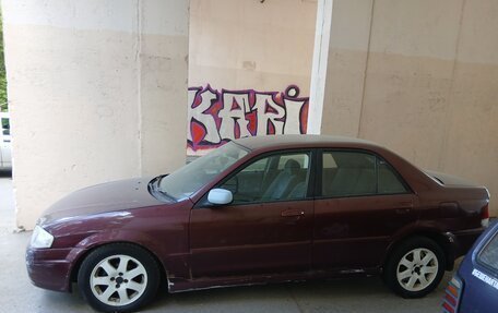 Ford Laser IV, 1999 год, 110 000 рублей, 8 фотография