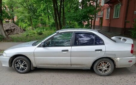 Mitsubishi Mirage VI рестайлинг, 2000 год, 100 000 рублей, 2 фотография