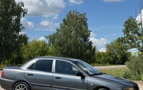 Mitsubishi Carisma I, 2002 год, 300 000 рублей, 28 фотография