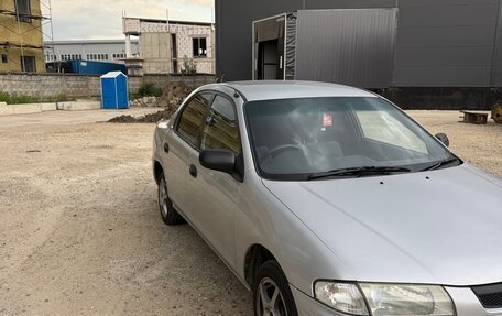 Mazda Familia, 1997 год, 245 000 рублей, 10 фотография