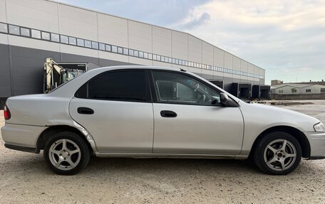 Mazda Familia, 1997 год, 245 000 рублей, 9 фотография