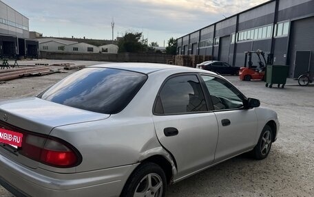Mazda Familia, 1997 год, 245 000 рублей, 7 фотография
