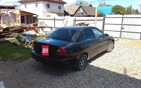 Mitsubishi Mirage VI рестайлинг, 1999 год, 130 000 рублей, 3 фотография