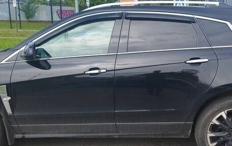 Cadillac SRX II рестайлинг, 2011 год, 670 000 рублей, 3 фотография