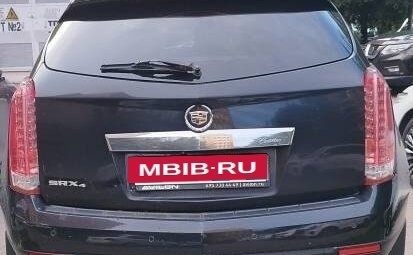 Cadillac SRX II рестайлинг, 2011 год, 670 000 рублей, 2 фотография