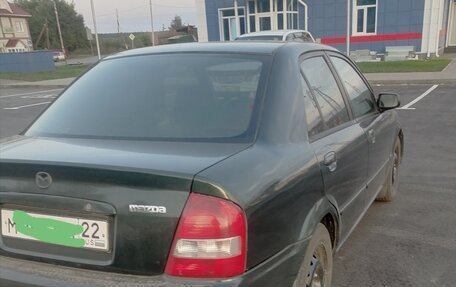 Mazda Protege, 2001 год, 310 000 рублей, 8 фотография