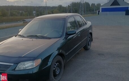 Mazda Protege, 2001 год, 310 000 рублей, 13 фотография
