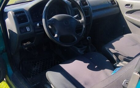 Mazda 323, 1998 год, 140 000 рублей, 9 фотография