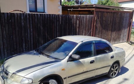 Mazda 323, 1997 год, 220 000 рублей, 7 фотография