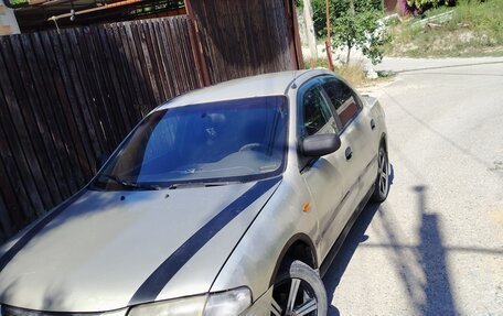 Mazda 323, 1997 год, 220 000 рублей, 6 фотография